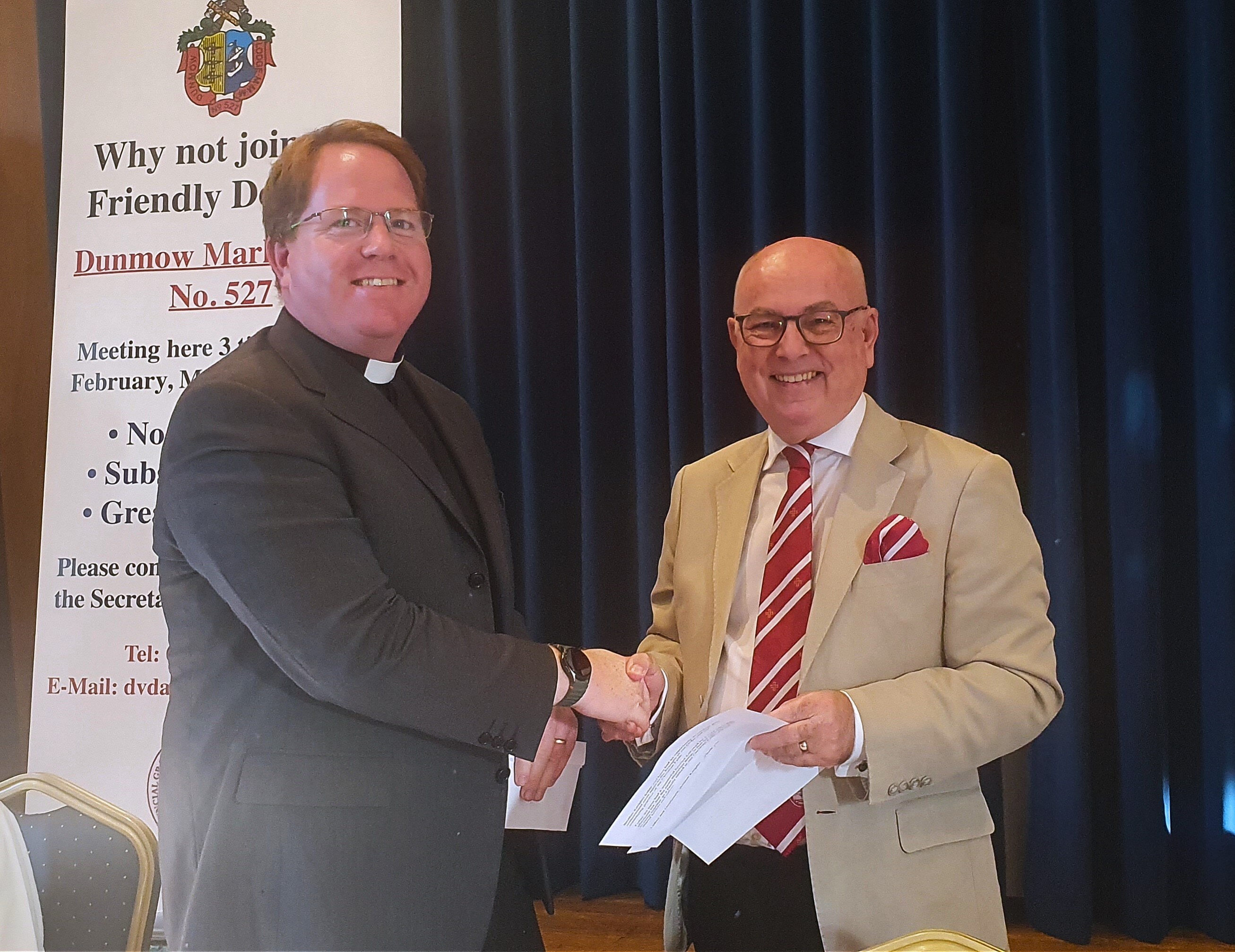 The Dean of Bocking receives a donation from the Provincial Prior